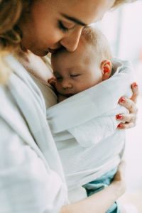 Mother and baby hugging. 