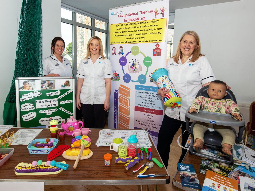 Paediatric Occupational Therapists Gretta O’Donnell and Laura Maguire alongside Physiotherapist Julie Robinson at their information stands.