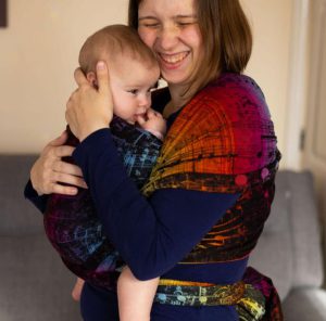 Emma Fraser holding a baby.