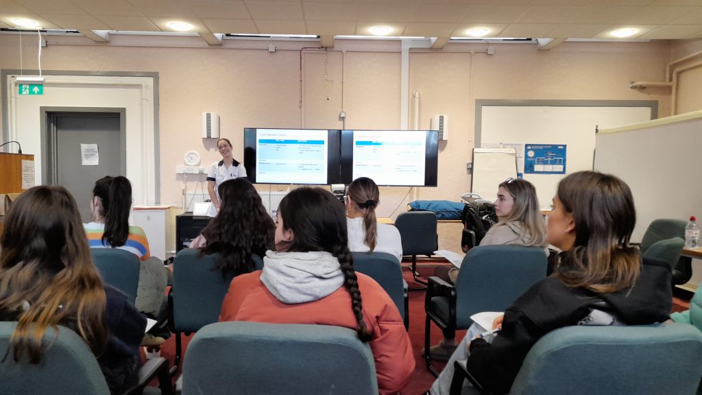 A group of people in a room receiving training on becoming mealtime support volunteers