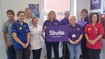 The Stroke Buddies standing alongside staff from the stroke unit at Lurgan Hospital