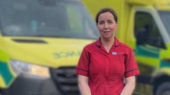 Sister Lisa Small standing in front of ambulances at Daisy Hill Hospital