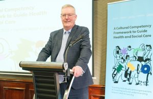 Man standing behind a podium