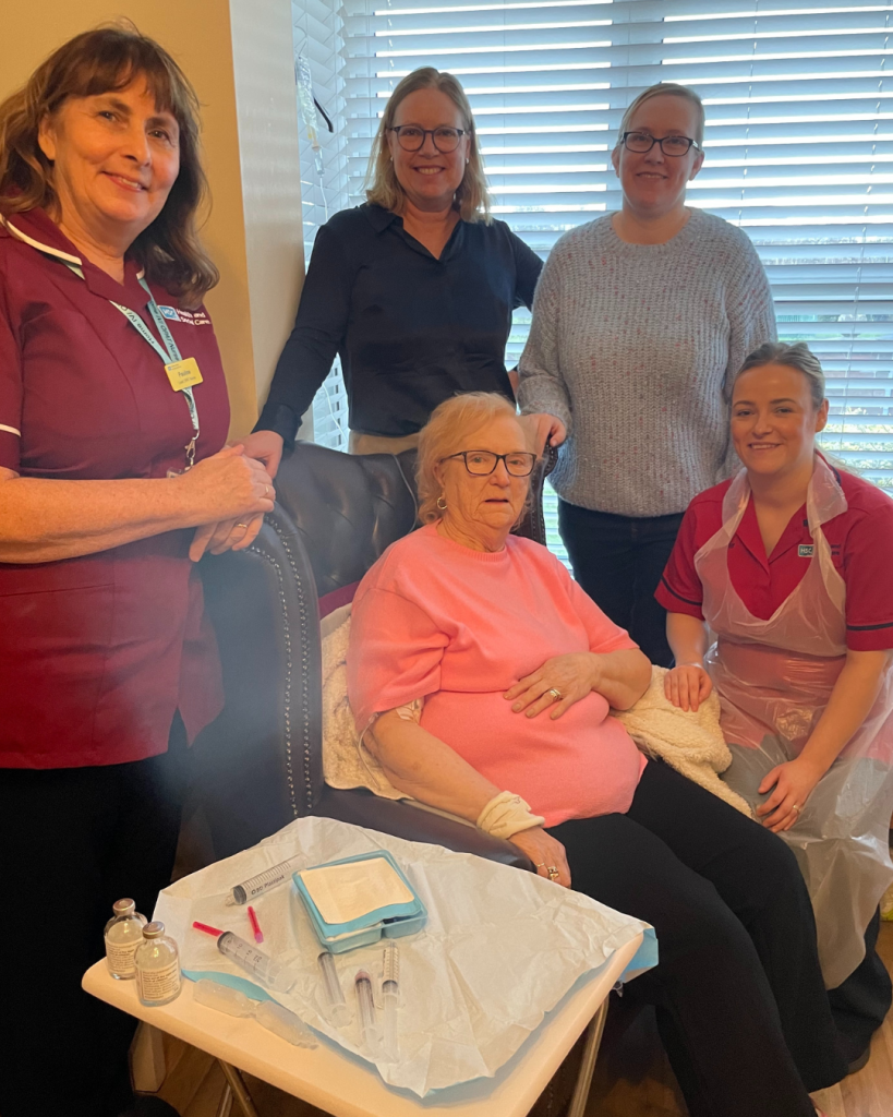 Ida Halfpenny at home surrounded by her daughter Patricia, Pauline Curran, IV nurse co-ordinator, Dr Sara Hedderwick, Consultant Microbiology Lead and Sr Maria McCann, District Nurse.