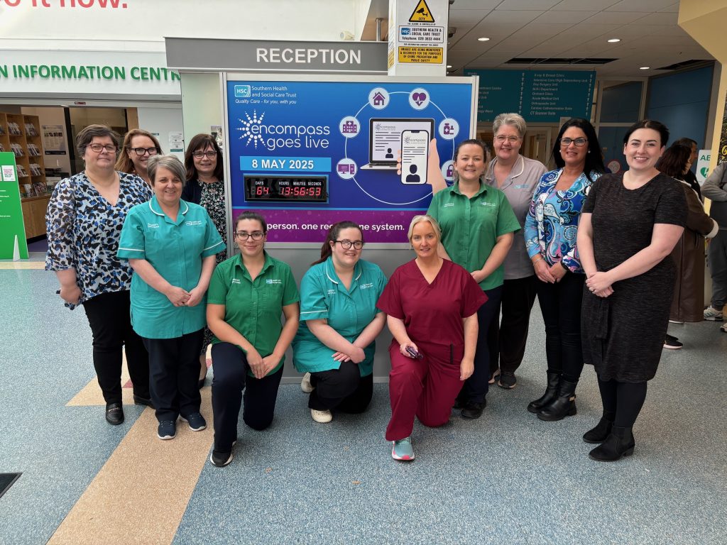 Staff at Craigavon Area Hospital pictured at the encompass countdown clock in the hospital foyer.