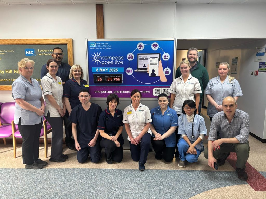 Staff at Daisy Hill Hospital pictured at the encompass countdown clock in the hospital foyer.