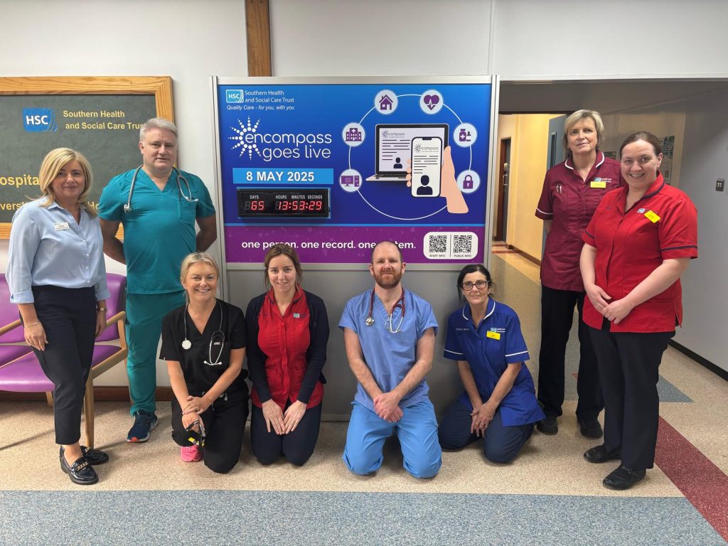 Staff at Daisy Hill Hospital pictured at the encompass countdown clock in the hospital foyer.