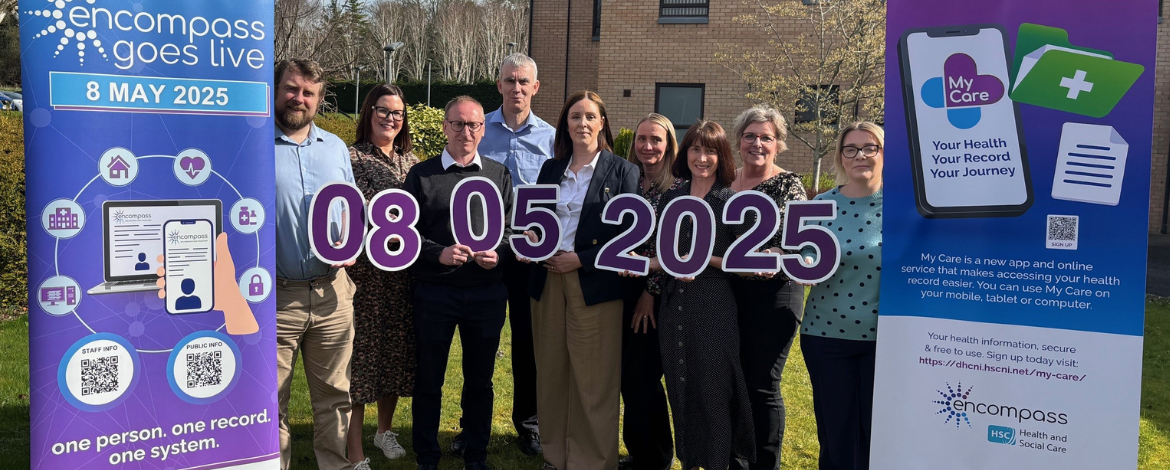 encompass Project team holding up purple numbers reflecting the date of encompass go live in Southern Trust