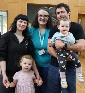 Eimear & family with Midwife Paula