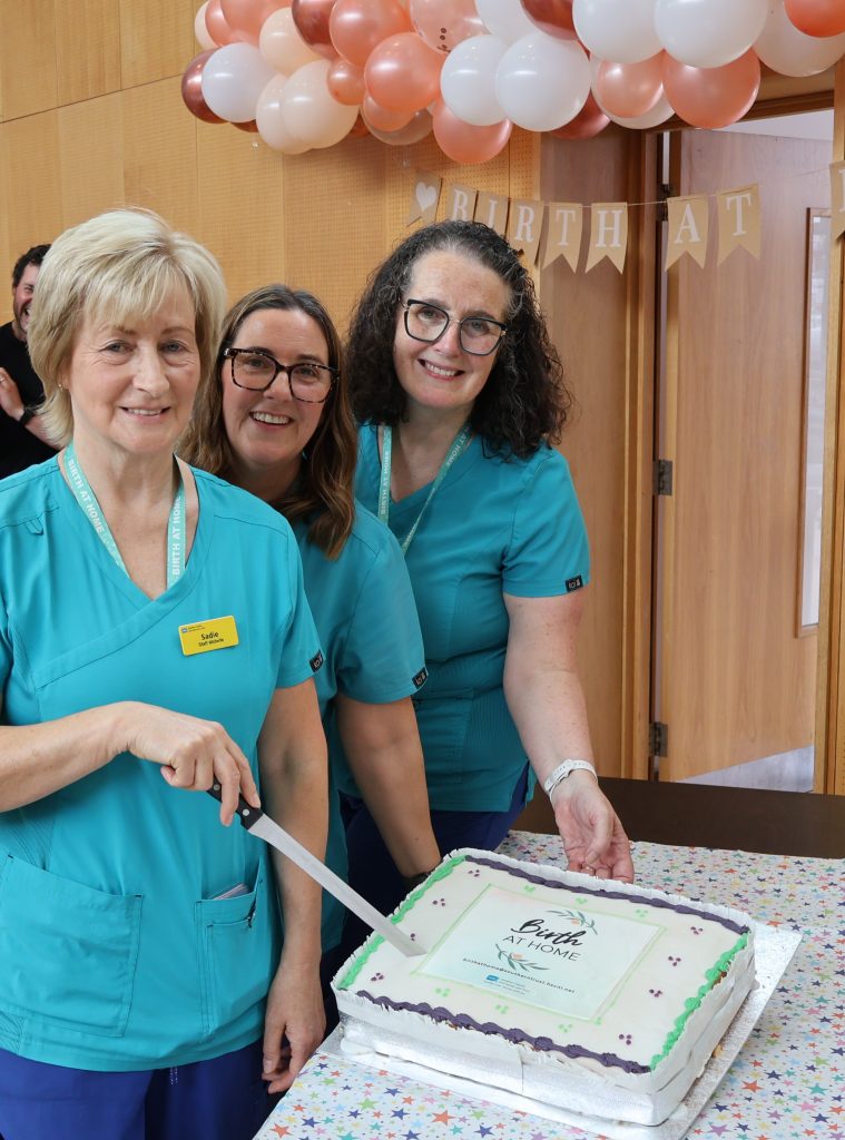 Birth at Home midwives Paula, Cherry and Sadie cut the cake