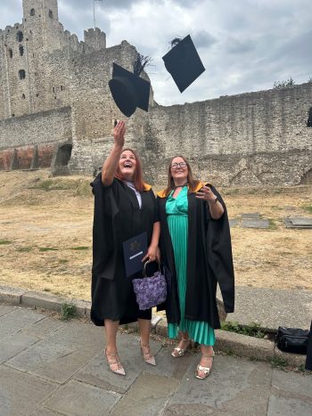 Throwing graduation hats in air